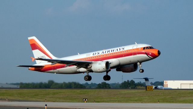 Airbus A319 (N742PS) - Taking off into the sunset with a big smile... One of the US Airways Airbus A319s painted in  the "legacy colors" of PSA (Pacific Southwest Airlines). PSA merged with US Air in 1989. Thousands of former PSA employees still work at US Airways. This paint job is a tribute to them.