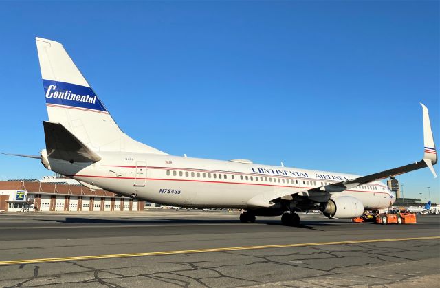 Boeing 737-900 (N75435) - UA/CO B737-900 Special Livery 02/11/22 under tow from the RWY14 approach