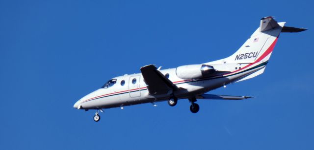 Beechcraft Beechjet (N25CU) - About to touch down is this 2003 Hawker Beechcraft 400XP in late Winter 2023.