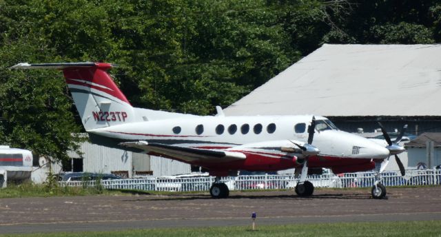 Beechcraft Super King Air 200 (N223TP) - Catching some tarmac time is this 1983 Beechcraft Super King Air 200 in the Summer of 2021.