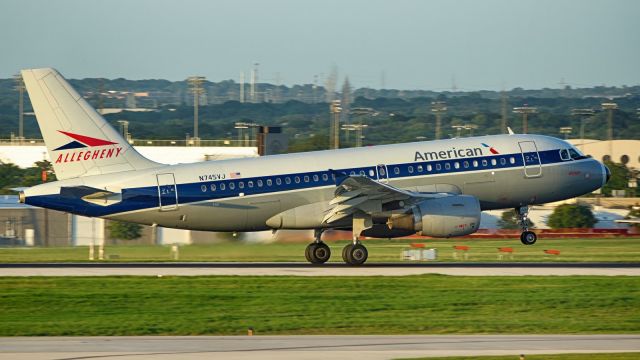 Airbus A319 (N745VJ) - 13R arrival just before sunset.