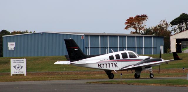 Beechcraft Baron (58) (N777TK) - Taxiing to departure is this 1979 Beechcraft Baron 58 in the Autumn of 2021.