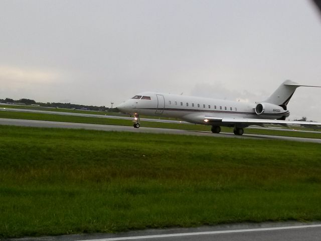 Bombardier Global Express (N143QS) - out side of fence area and pictured it taxi to take off 