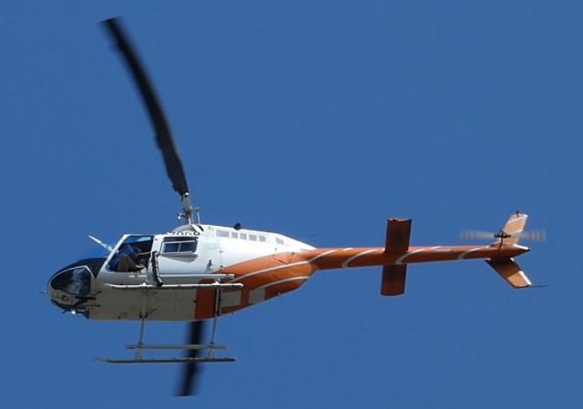 Bell JetRanger (N67908) - Sitting at my house and this 206 flew over me dropping Rabies Vaccines