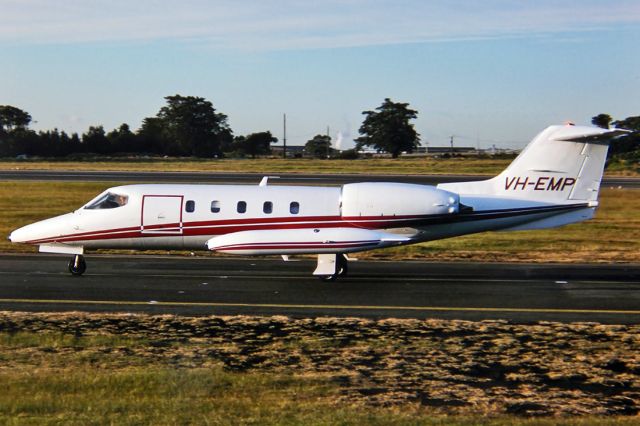 Beechcraft Baron (58) (VH-EMP) - GATES LEARJET 35A - REG : VH-EMP (CN 35A/345) - KINGSFORD SMITH SYDNEY NSW. AUSTRALIA - YSSY - 28/6/1988 35MM SLIDE CONVERSION USING A LIGHTBOX AND A NIKON L810 DIGITAL CAMERA IN THE MACRO MODE.