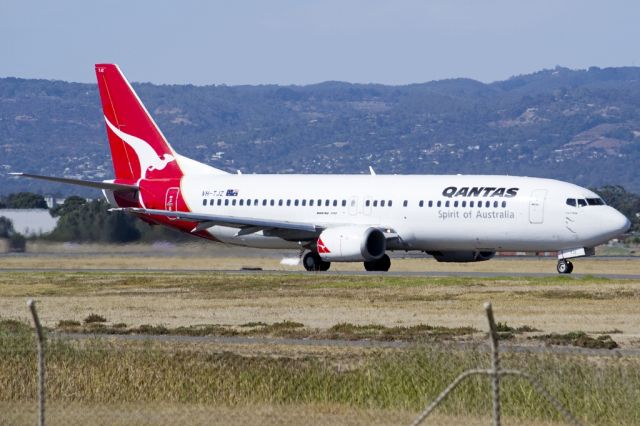 BOEING 737-400 (VH-TJZ) - A Qantas old girl on the taxi-way, heading for take off on runway 05. Friday, 19th April 2013.