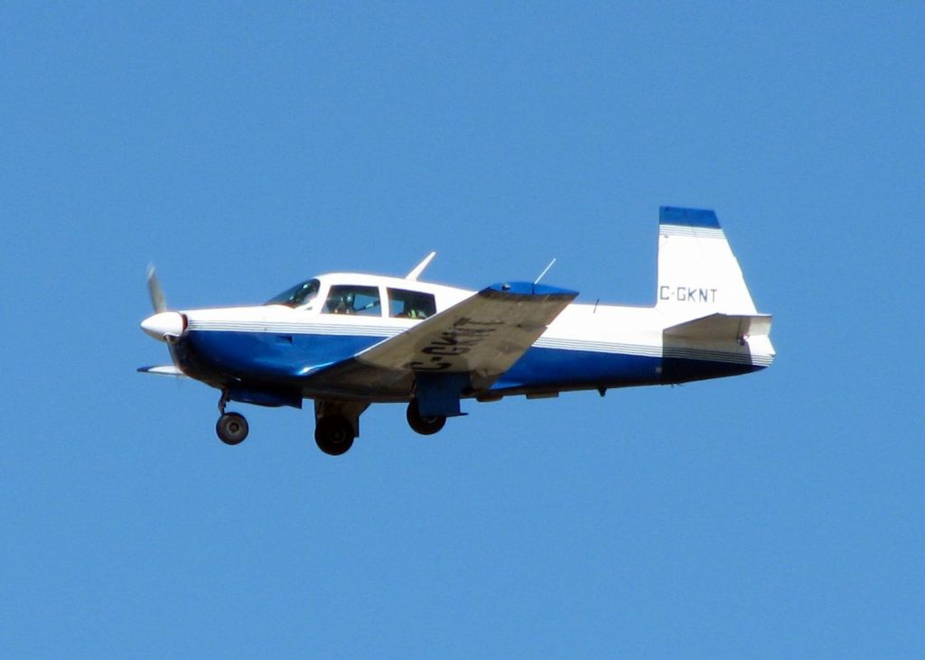 Mooney M-20 (C-GKNT) - Landing on runway 23 at the Shreveport Regional Airport. A long way from home!