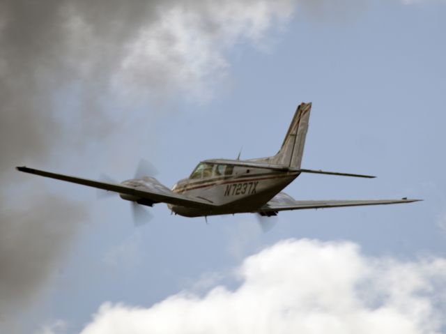 Beechcraft Baron (58) (N7237X) - Take off runway 26.