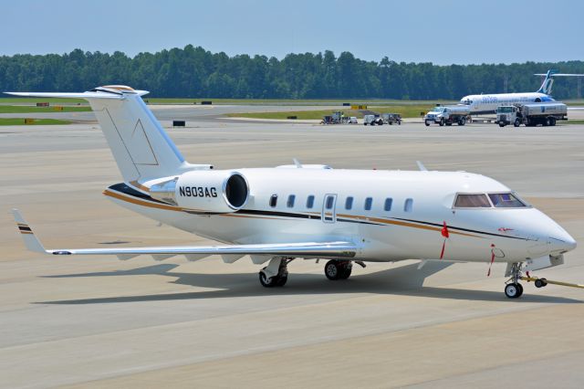 Canadair Challenger (N903AG) - being towed up for departure at Landmark