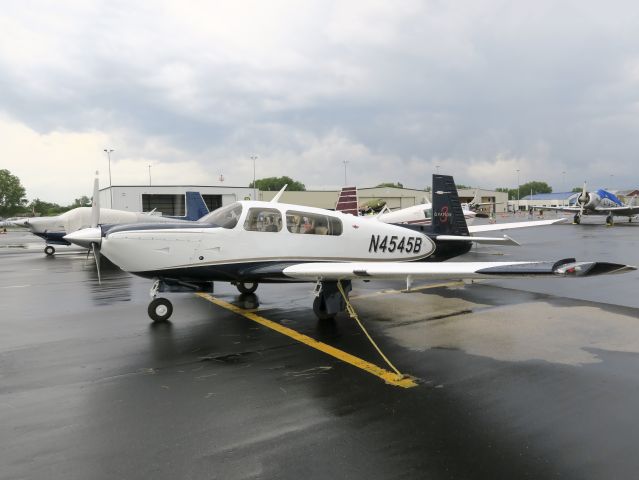 Mooney M-20 (N4545B) - Gathering for the Mooney arrival at Oshkosh. 18 August 2015.