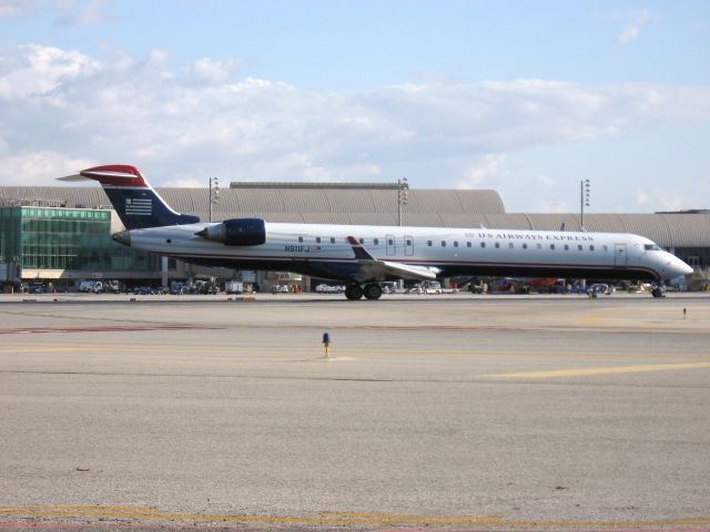 Canadair Regional Jet CRJ-900 (N911FJ) - Holding on RWY 19R