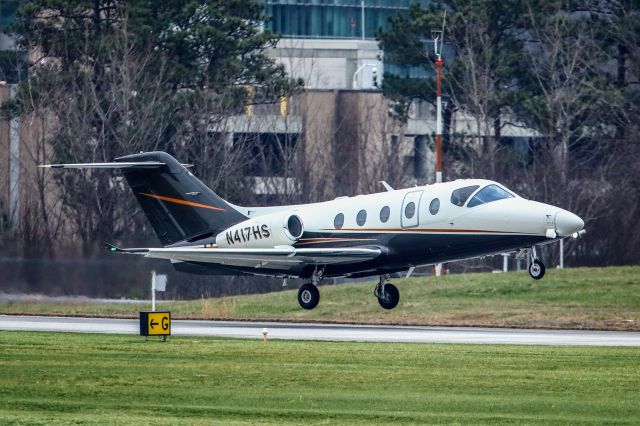 Beechcraft Beechjet (N417HS) - This 2006 Hawker 400A was just about to touch down at Atlanta's PDK executive airport, when I got this shot. I was using a Canon 5DSR camera. The lens was a Canon 500mm F4 IS, that had a 1.4 extender on it, effectively making it a 700mm lens. Camera settings were 1/8000 shutter, F5.6, ISO 3200. Please check out my other aviation photography. Votes and positive comments are always appreciated. Questions about this photo can be sent to Info@FlewShots.com