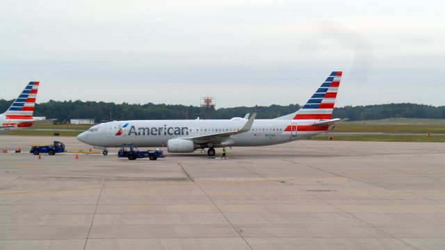 Boeing 737-800 (N921AN) - American N921AN being backed away from terminal at KBDL, early AM.