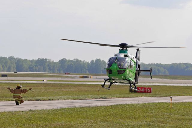 N911PX — - Promedica-1 approaching the landing zone during the Toledo Express Airport triennial emergency exercise on 18 May 2021. One of our firefighters from the 180th Fighter Wing marshalling Promedica-1 to the LZ on TWY Alpha on 18 May 2021. 