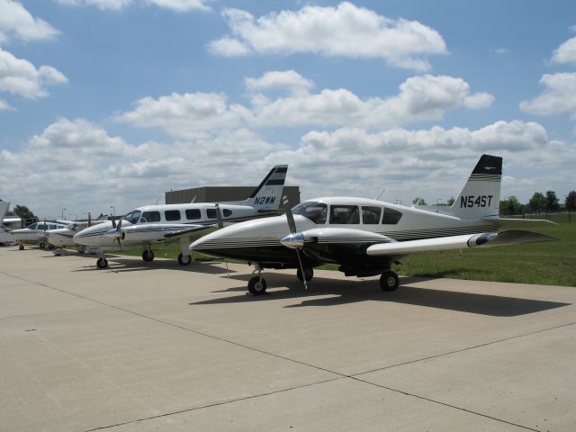 Piper Aztec (N54ST) - Aztec N54ST on the ramp at KMKC with its big brother N2WM. Airplane is based at KASG.