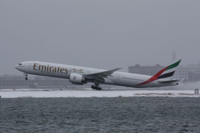 BOEING 777-300ER (A6-ECJ) - Morning lift off from BOS to Dubai before a winter storm hit New England. 