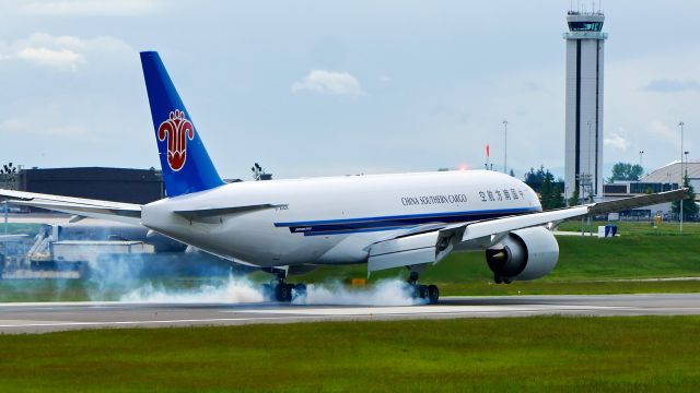 Boeing 777-200 (B-20EN) - BOE29 makes tire smoke during a touch-n-go landing on Rwy 16R during a FCF flight on 5.12.20. (B777-F1B / ln 1650 / cn 65422).