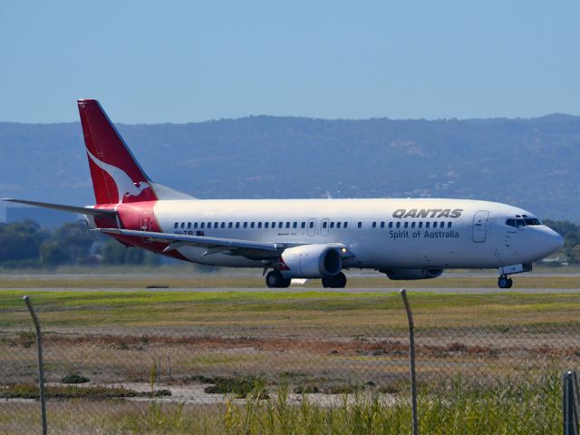 BOEING 737-400 (VH-TJR) - A Qantas old girl on taxi-way, heading for take off on runway 05. Thursday 12th April 2012.