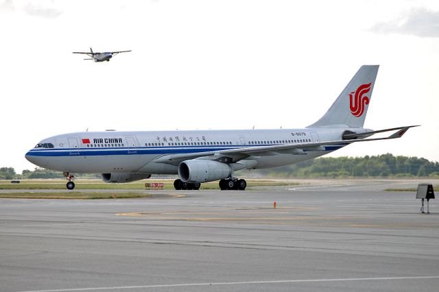 Airbus A330-200 (B-6079) - Pasco C-GPCF Shorts 360 landing at 08L in the background.