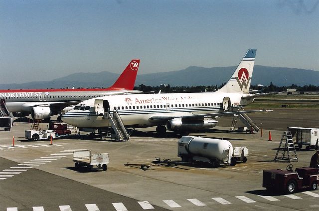 Boeing 737-200 (N141AW) - KSJC- photo from the now extinct Observation deck. This jet just arrived from KPHX and awaiting the passenger re-load for the flight back to Phoenix.