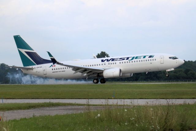 Boeing 737-800 (C-GKWA) - Landing Rwy 15, London, ON.