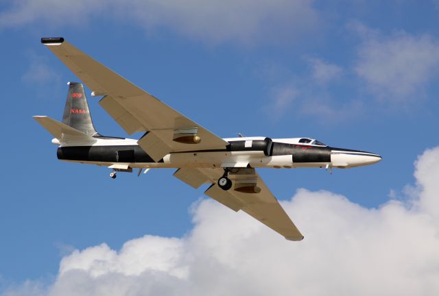 Lockheed ER-2 (NASA809) - A derivative of the U-2 Dragon Lady, NASAs ER-2 (Earth Resources -2) is a high altitude sensor aircraft.   N809NA or "NASA809" is assigned to the Dryden Flight Research Center on Edwards AFB, California and is based at the Dryden Aircraft Operations Facility hangar in Palmdale, California. It used for top-down, edge of space imaging and atmospheric sampling of Earth resources, disaster assessment, celestial observations, as well as oceanic processes and trending.     According to the ER-2 Handbook, Powered by a single jet engine, the ER-2 carries a single pilot and up to 2,550 lb of payload to altitudes approaching 70,000 ft. Typical ER-2 missions last 6.5 hours and cover a range of 2,200 nm. It is possible to accomplish missions of up to 8 hr duration ranging to 3,000 nm.   The nose, cockpit, optional wing pods, and Q-bay, just aft of the cockpit are all pressurized and climate controlled. There are other payload areas available, including the E-bay, wing tips, centerline pylon, and tail cone.  The nose and Q-bays tandem windows have 16 inch glass with heaters to defeat condensation at altitude. The windows can be replaced by plates that will allow sensor probes that require access to the outside of the pressure vessel.   For added situational awareness for the pilot, a small remotely controlled camera gimbal is mounted on the belly of the ER-2, just under the cockpit. This Optical View Sight is used to see what is underneath the aircraft while in level flight.    NASA 809 has been deployed to Ellington Field in Houston to fly sorties to record and assess the effects of British Petroleums MC252 Deepwater Horizon explosion and subsequent oil spill on the Gulf of Mexico. The ER-2 was tasked with these overflights to utilize the highly specialized AVIRIS Airborne Visible Infrared Imaging Spectrometer imaging, a 224 band hyper-spectral scanner designed by the Jet Propulsion Laboratory in Pasadena, California. The AVIRIS system is an 800 lb unit mounted in the Q-bay.  In addition to the scanners imaging, regular photographs are obtained by the nose mounted Hasselblad camera with digital back, utilizing a Zeiss lens and a Tiffen yellow filter. To service the camera, the nose removes completely from the airframe with 4 quick release latches.