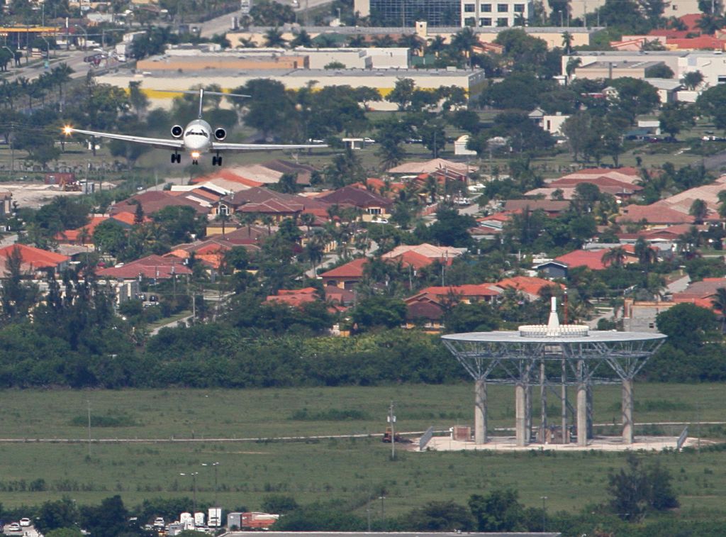 — — - Aerial Photo taken from overhead Miami International Airport at about 1,000 feet. On final into MIA. Head On View of aircraft almost over VOR