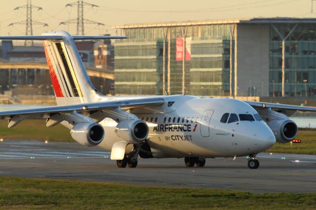 — — - Lining up at London City Airport for departure.