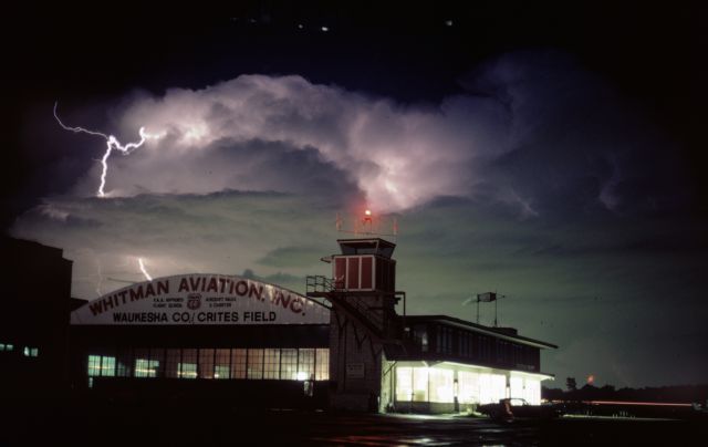 — — - Crites Field terminal and control tower 1981.  Thunderstorm over Lake Michigan.