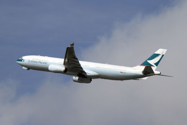 Airbus A330-300 (B-HLQ) - Some condensation is visible coming from the left winglet.