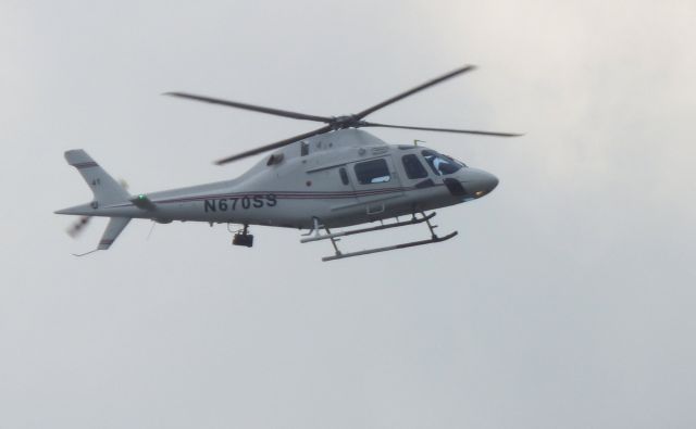 N670SS — - Shown here is a Agusta Westland AW119MKII a moment from landing in the middle of my taking photos of the Solar Eclipse in the Summer of 2017.   Always be ready to switch to Automatic on your camera. 