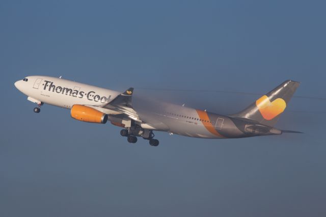 Airbus A330-200 (G-OMYT) - TCX3732 emerging from the low lying fog on departure to BGI.