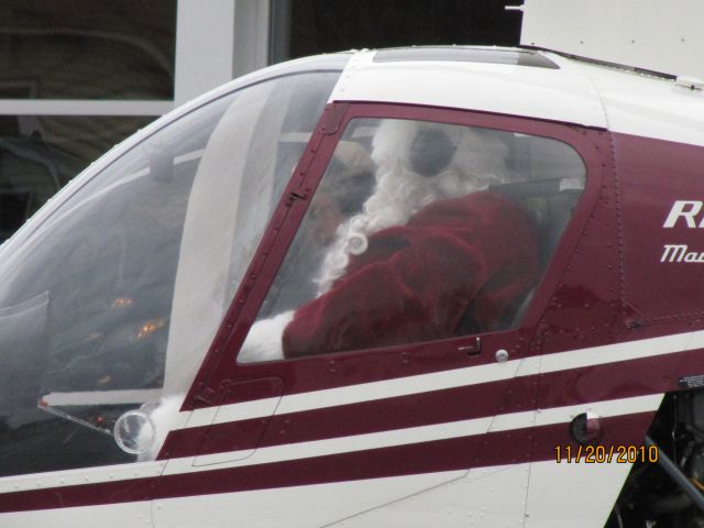 Robinson R-22 (C-FSTW) - Santa is ready to step out of chopper near the mall in Bridgewater NS    Nov 20,2010