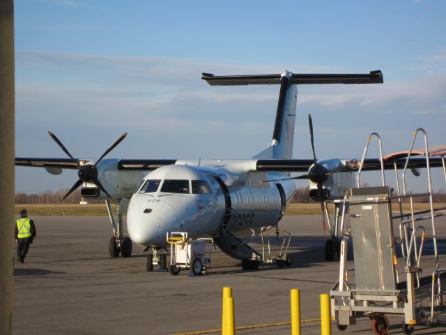 de Havilland Dash 8-100 (C-FJMG) - Air Canada express aircraft in Kingston  about to depart to Toronto.  I liked the old Jazz colours better, but, the new express colours are very stylish in this light