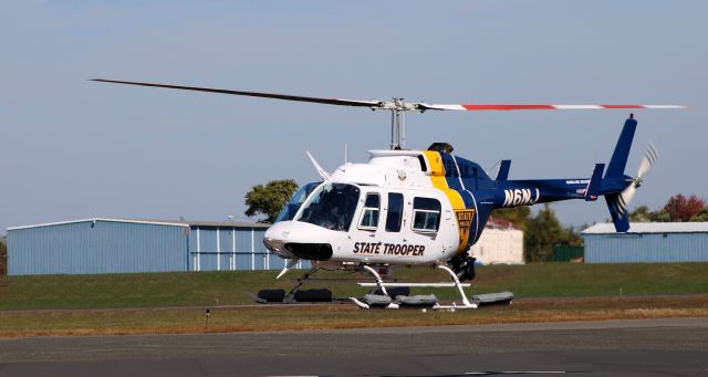 Bell JetRanger (N6NJ) - About to touch down is this 1995 New Jersey State Trooper Bell 206L-4 JetRanger rotorcraft in the Autumn of 2022.