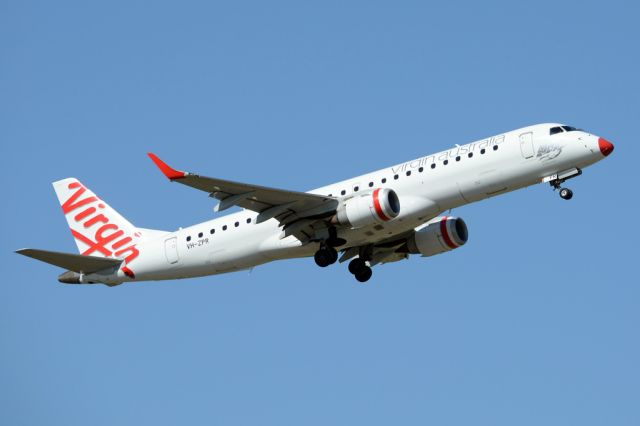 Embraer ERJ-190 (VH-ZPR) - Wearing a red nose and getting airborne off runway 23.  Monday 25th August 2014.  