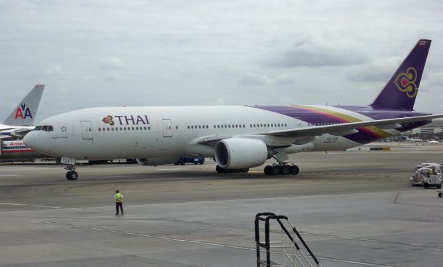 Boeing 777-200 (HS-TJV) - Thai Airways 777-2D7/ER HS-TJV pulling into the TBIT at LAX on Oct 18, 2012.
