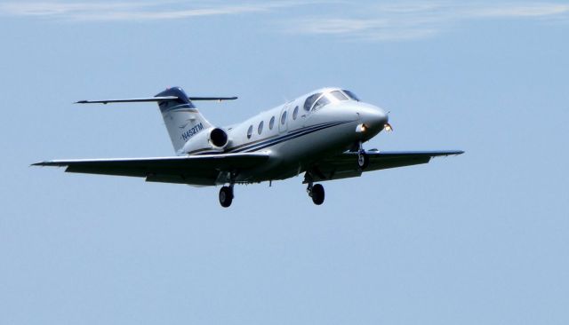 Beechcraft Beechjet (N452TM) - On final is this 2008 Hawker Beechcraft Beechjet 400XP in the Summer of 2019.