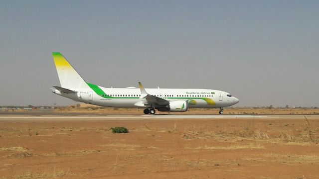 Boeing 737 MAX 8 (5T-CLJ) - Waiting to cross the runway while the first Boeing 737 MAX ever built is taking off.