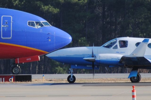 — — - at KRDU at TAC Air - watching planes taxi.  Love the faces and the pilots focus.