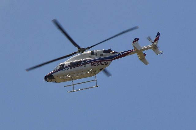 Bell 427 (N595JG) - JOE GIBBS RACING INC flying over R&R BBQ on the way to the track near KJQF - 5/25/19