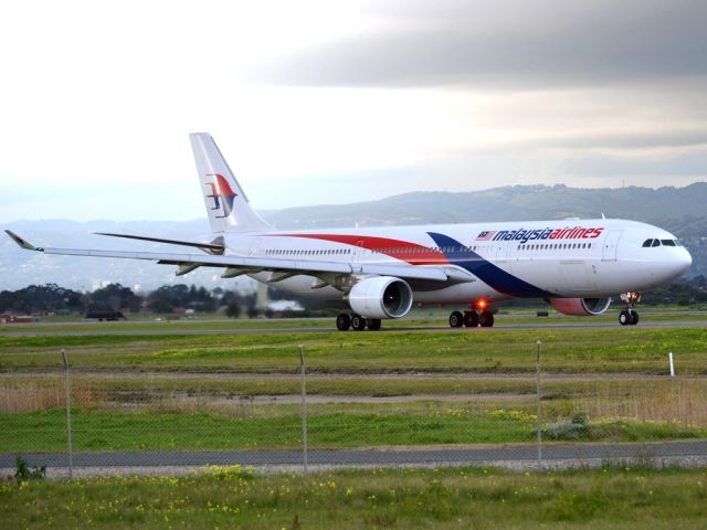 Airbus A330-300 (9M-MTC) - On taxi-way heading for take off on runway 05, for flight home to Kuala Lumpur, just before the arrival of a rain storm. Thursday 12th July 2012.