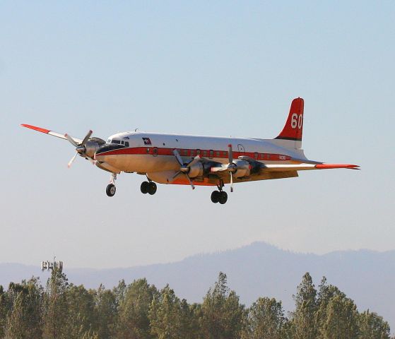 Douglas DC-7 (N838D) - KRDD - DC-7B Erickson Aero Tanker N838D, Sept 2014 returning from Weed,CA for more PhosCheck before turning back north to help fight the Boles Fire in Weed.