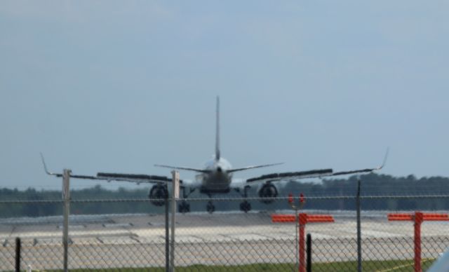 Boeing 757-200 (N541US) - 4/22/23 Lining up for departure on Rwy 18L. About 1500' in to take off roll, spoilers came up, departed runway about 1/2 way down. Sat on the taxiway for about 20 minutes then ended up going back to the gate. Never did hear what the problem was.