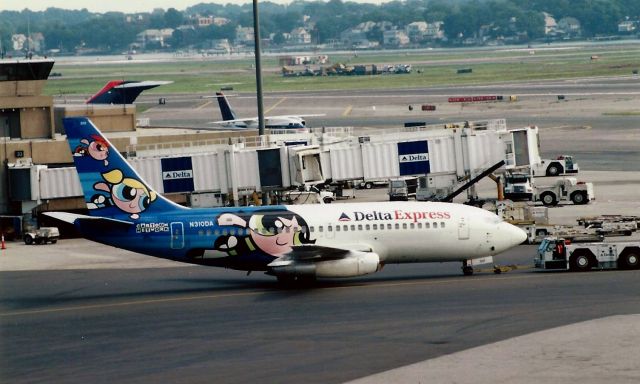 Boeing 737-200 (N310DA) - From August 2001 - Delta Express B737-200 in special Power Puff Cartoon livery pushes back at Terminal C. 