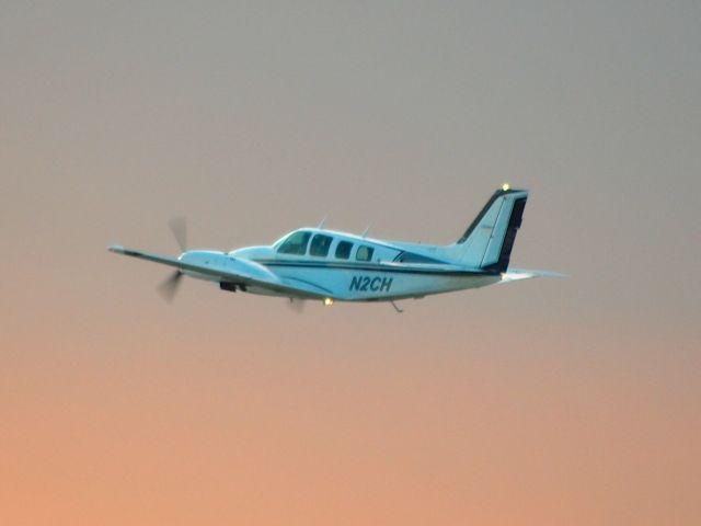 Beechcraft Baron (58) (N2CH) - Departing EAA Airventure/Oshkosh on 24 July 2012