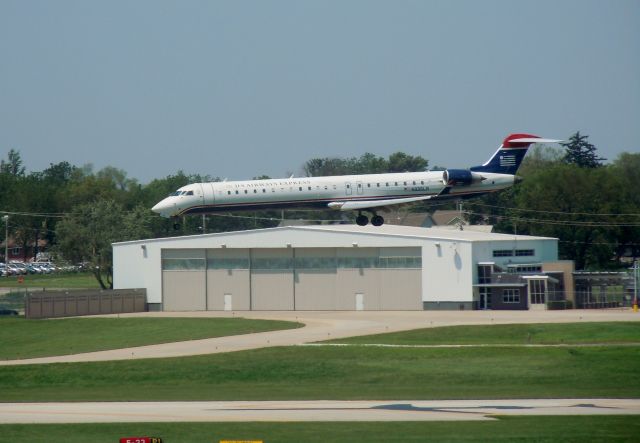 Canadair Regional Jet CRJ-900 (N935LR) - Trying to balance while trying to land in heavy winds on runway 23