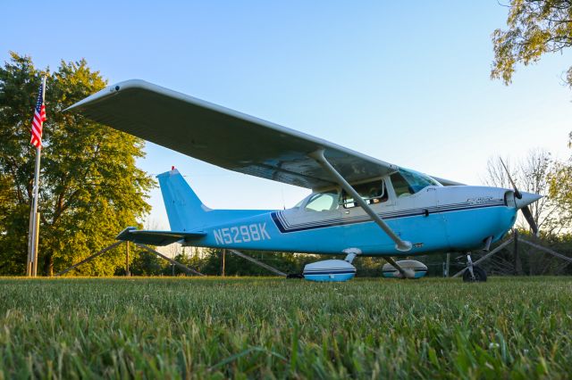 Cessna Skyhawk (N5298K) - Parked on the grass during the final hours of light.