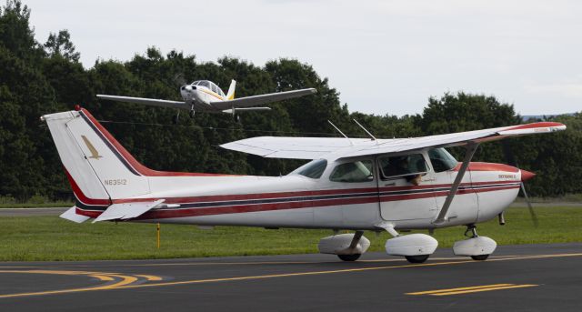 Cessna Skyhawk (N63512) - N63512 taxiing back to 02 while N3956M departs after doing a touch and go