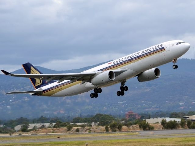 Airbus A330-300 (9V-STP) - Getting airborne off runway 23 and heading home to Singapore. Tuesday 27th December 2011.